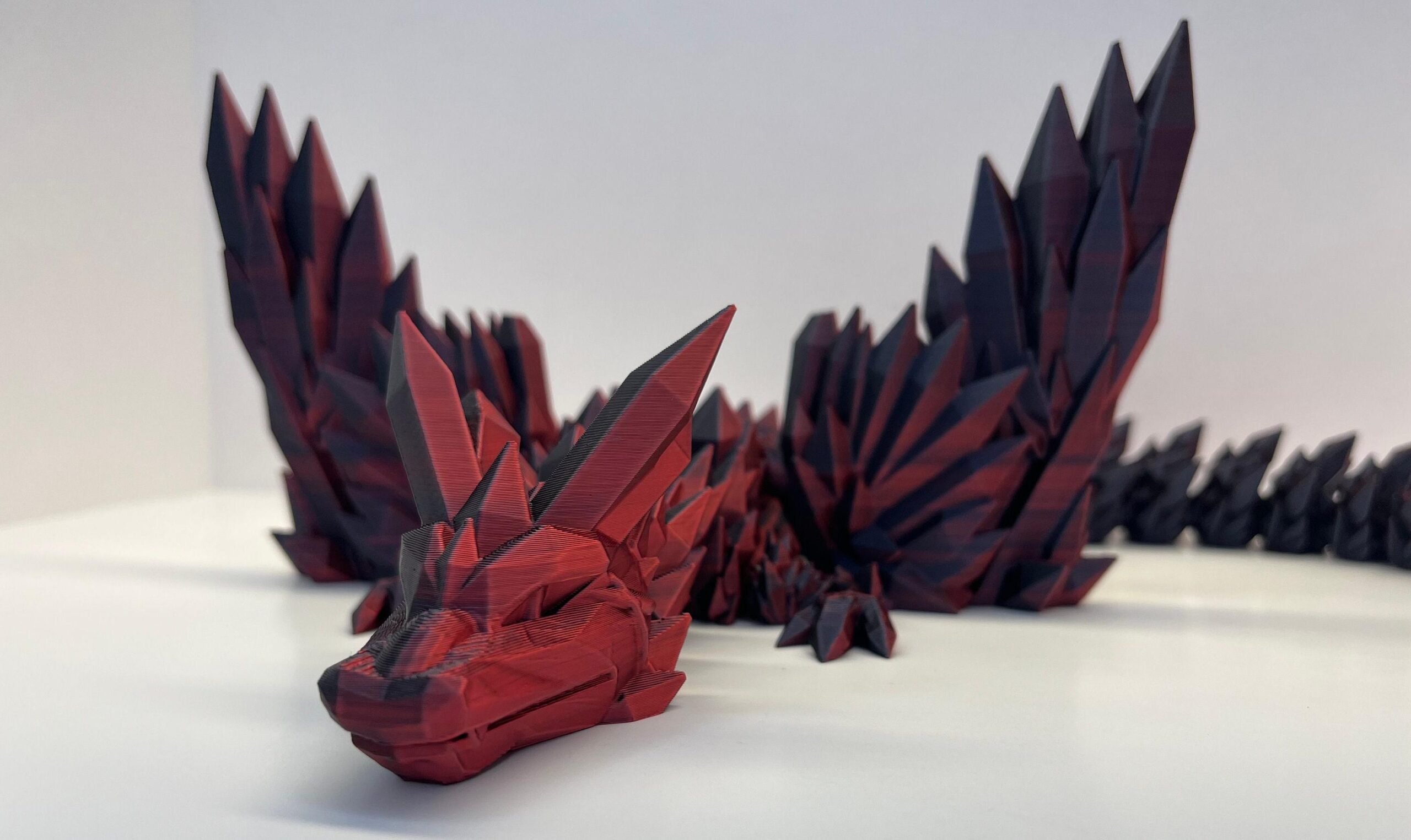 red 3d-printed dragon 